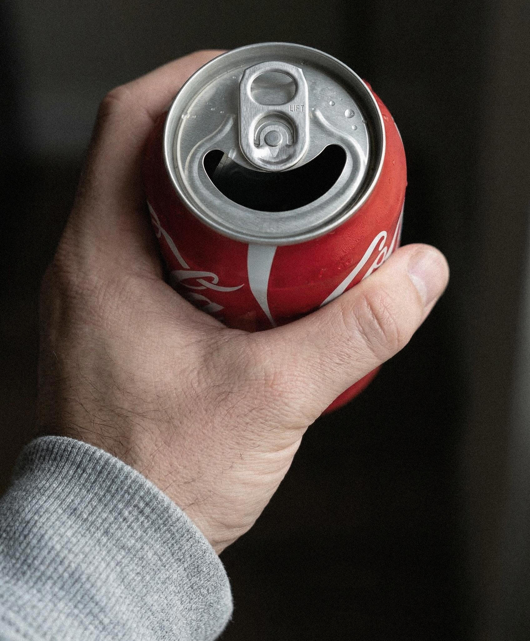 Man holding the happy can