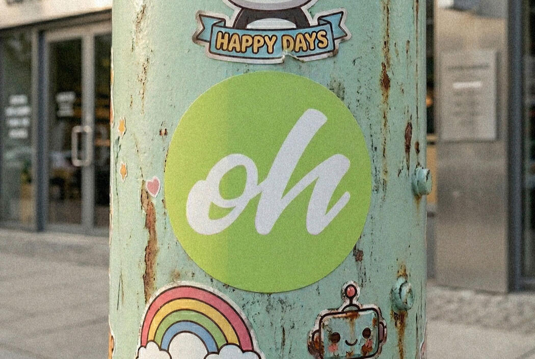 Ohania Sticker Sticker on a metal post, with "Oh" written on it